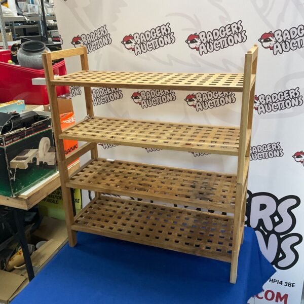Vintage wooden shelving unit with four tiers for display.