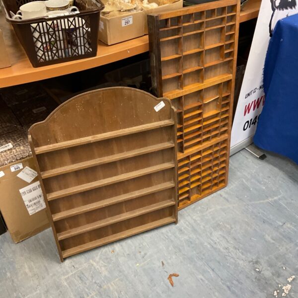 Vintage wooden toy car display frames on a wall.