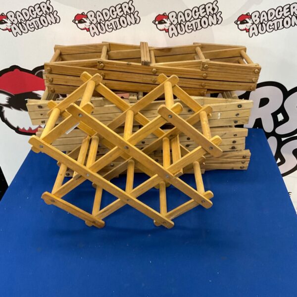 Set of five wooden wine racks for home storage.