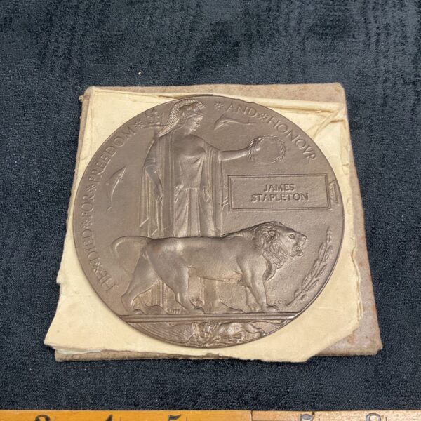 WW1 Death Plaque commemorating James Stapleton, a bronze memorial.
