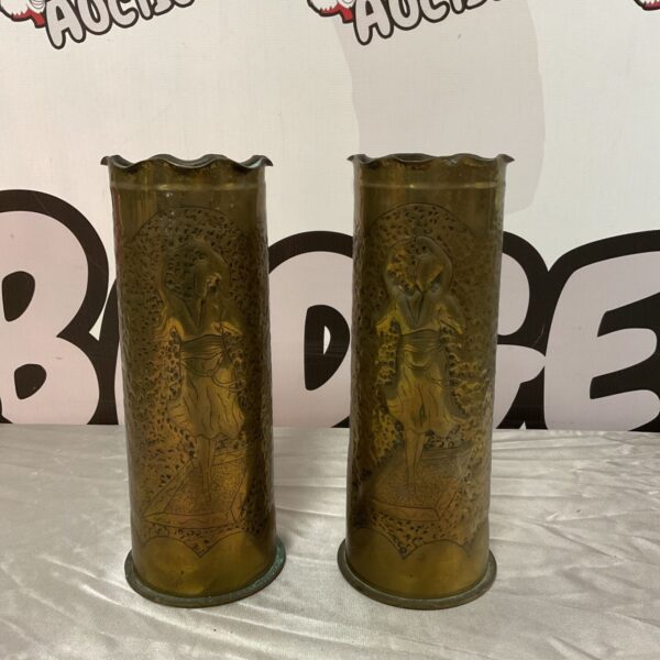 Pair of WW1 trench art shells with etched scenes.