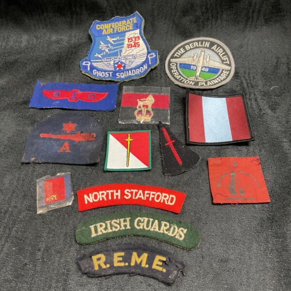 WW2 cloth patch collection featuring aviation and military insignia.