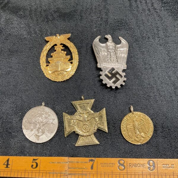 Reproduction WWII German badges and medals lot for collectors.