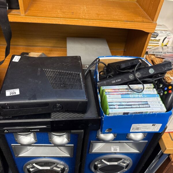 Xbox 360 and Xbox One console bundle with games and accessories.