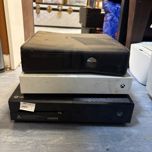 Lot of three Xbox consoles including 360, One, and Series X.