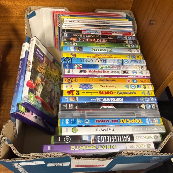 Mixed lot of Xbox games and DVDs for family entertainment.