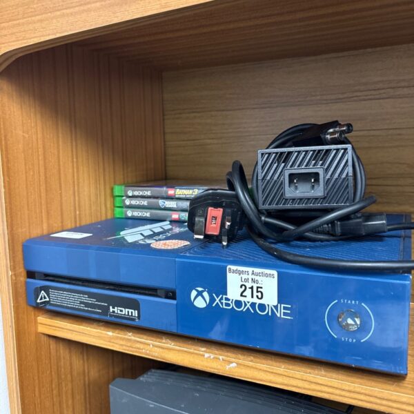 Microsoft Xbox One console with games and accessories.