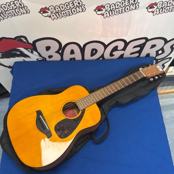 Yamaha FG Junior acoustic guitar with included case.