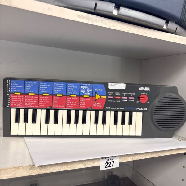 Vintage Yamaha PSS-6 Portasound keyboard synthesizer in grey.