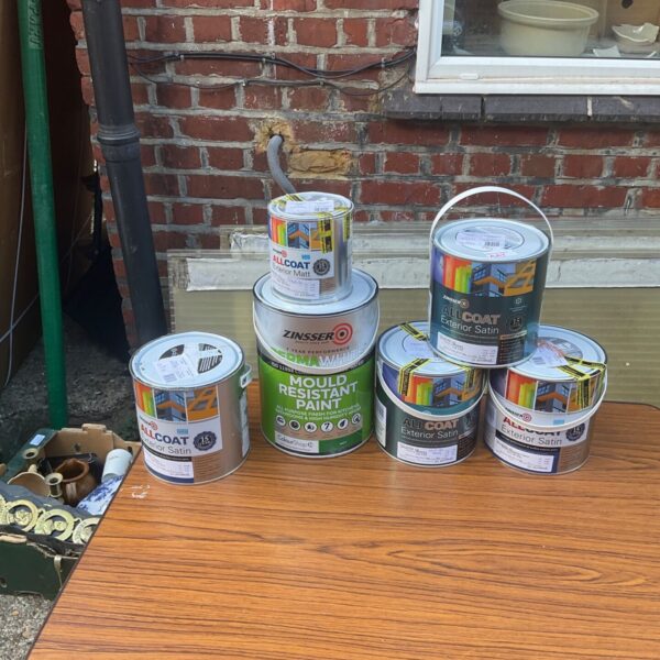 Assorted Zibseer Allcoat exterior paint tins for DIY projects.