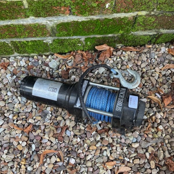 Blue synthetic rope on a 12v winch for vehicle recovery.