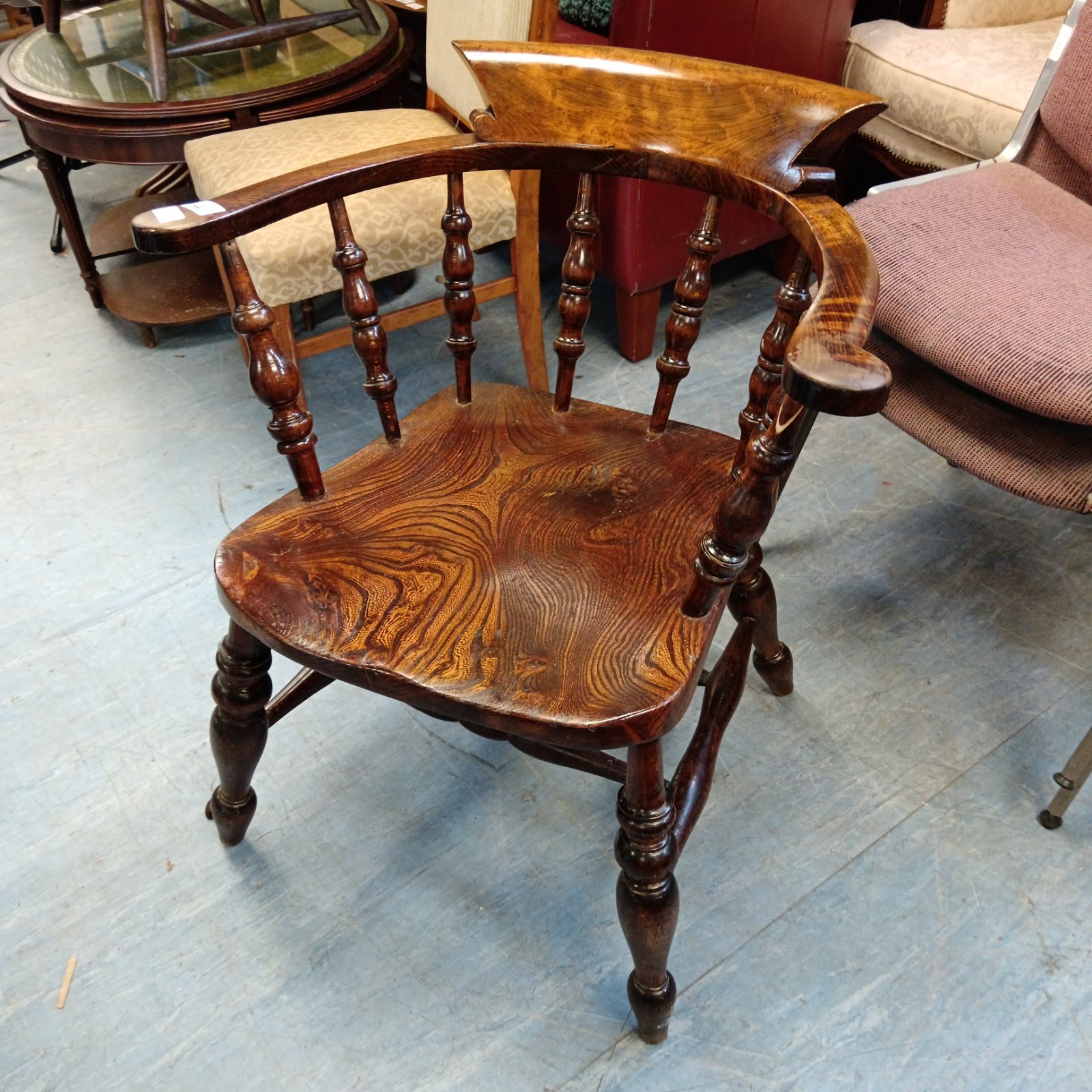 Antique 19th-century English Windsor Captain's chair with sculpted seat.