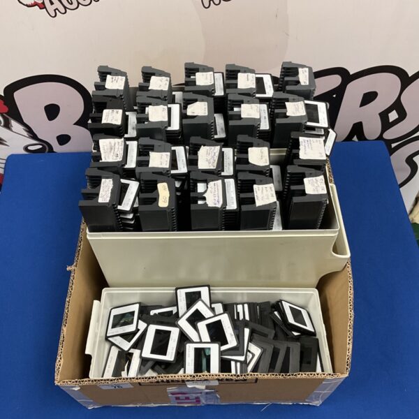 Large collection of 35mm slides in black mounts stored in plastic boxes
