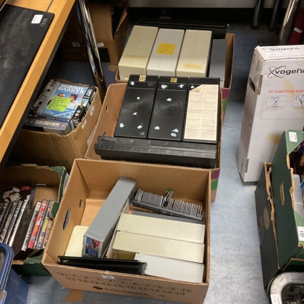 Three boxes of 35mm slides housed in plastic storage cases