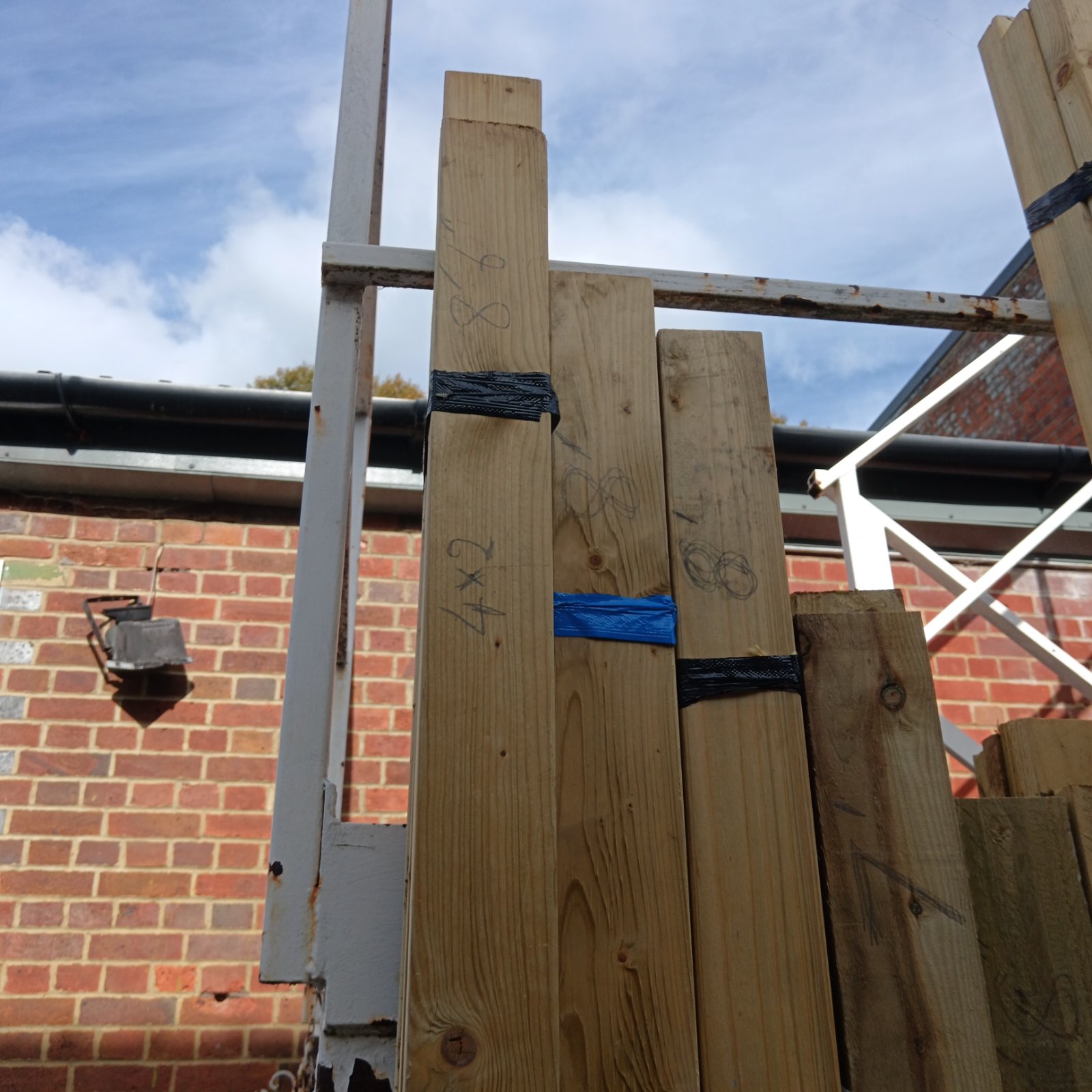 Bundle of 4x2 inch softwood timbers for construction projects.
