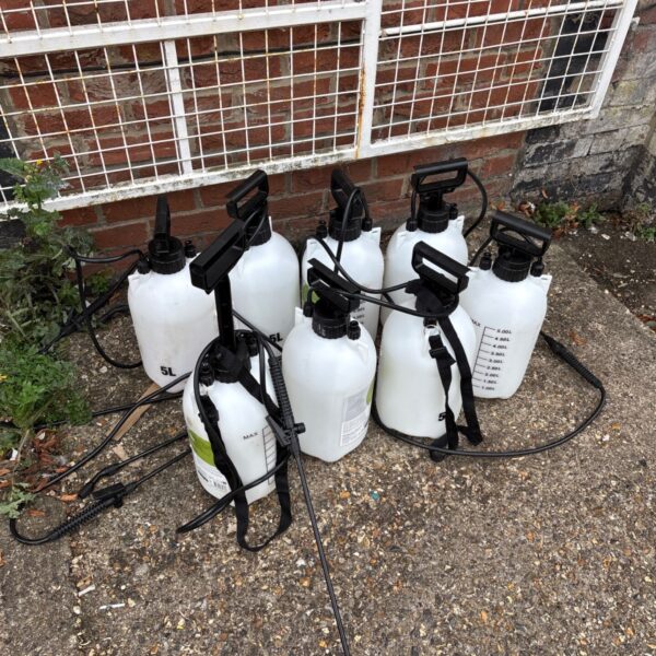 Lot of eight 5L hand pump sprayers for garden use.