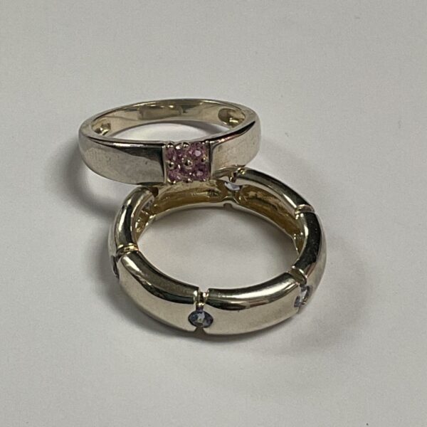 Two 925 silver rings, one with pink stones and one with white stones