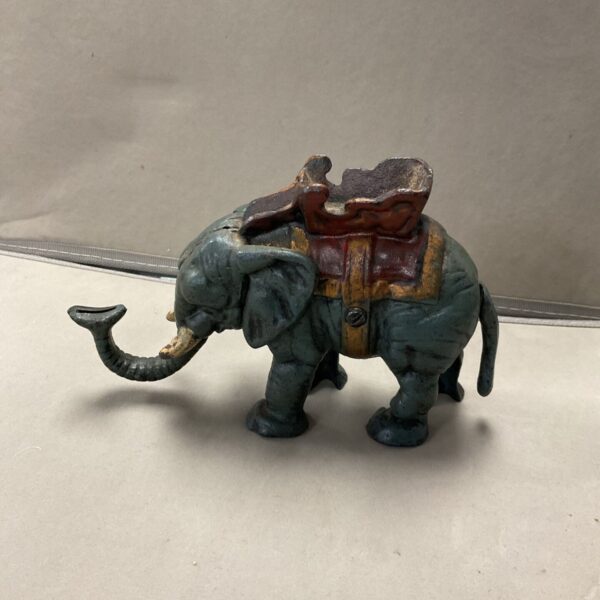 Antique cast iron elephant mechanical money bank with raised trunk and howdah