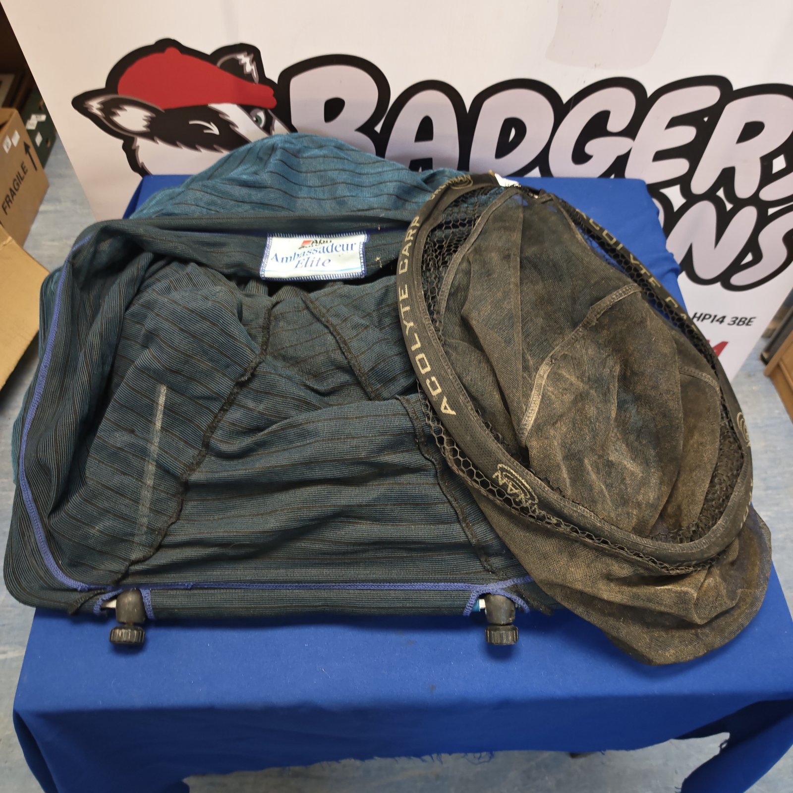Used Abu Garcia Acolyte carp fishing net with mesh visible.
