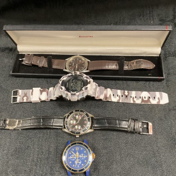 Four wristwatches including boxed Accurist watch and camouflage digital watch