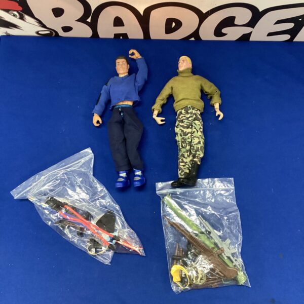 Vintage Action Man figures with skiing kit and weapons accessories.