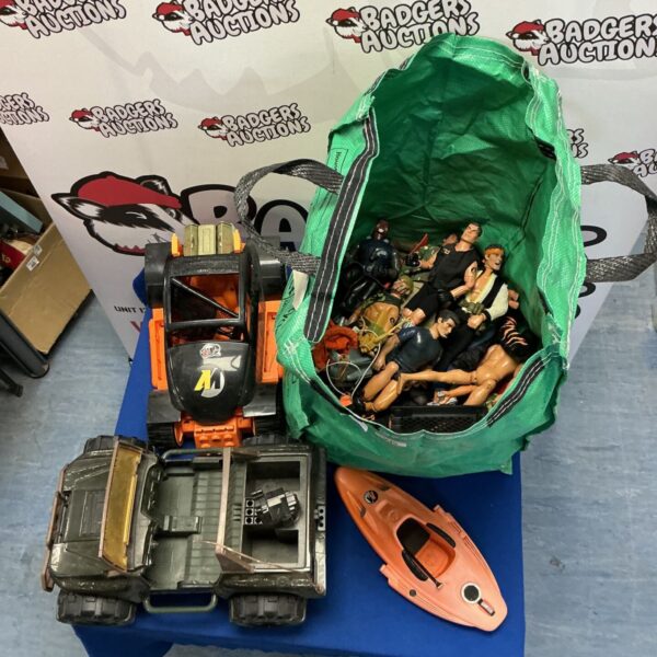 Vintage Action Man toy collection with figures and vehicles.