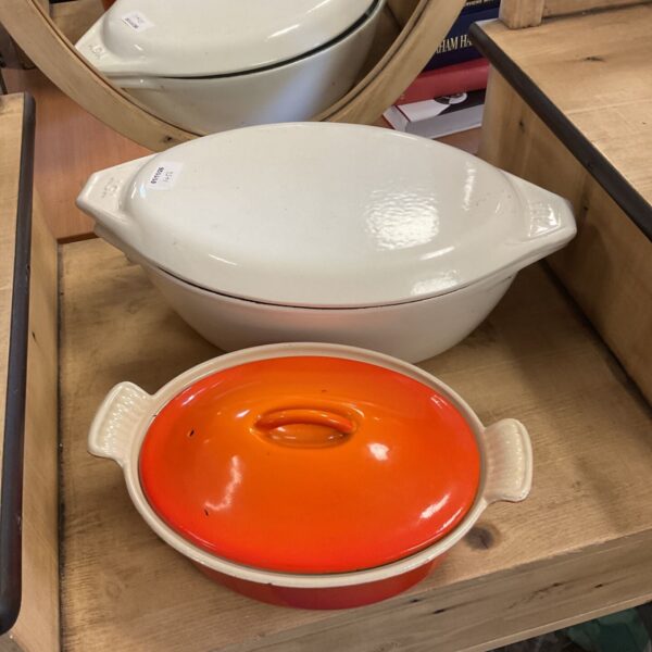 Two white Aga cast iron casseroles and an orange Cousances casserole with lids
