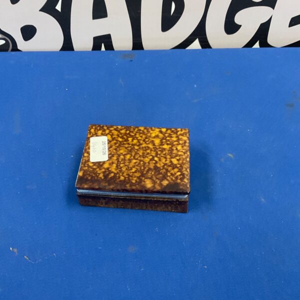 Closed alabaster trinket box with mottled amber and brown lid