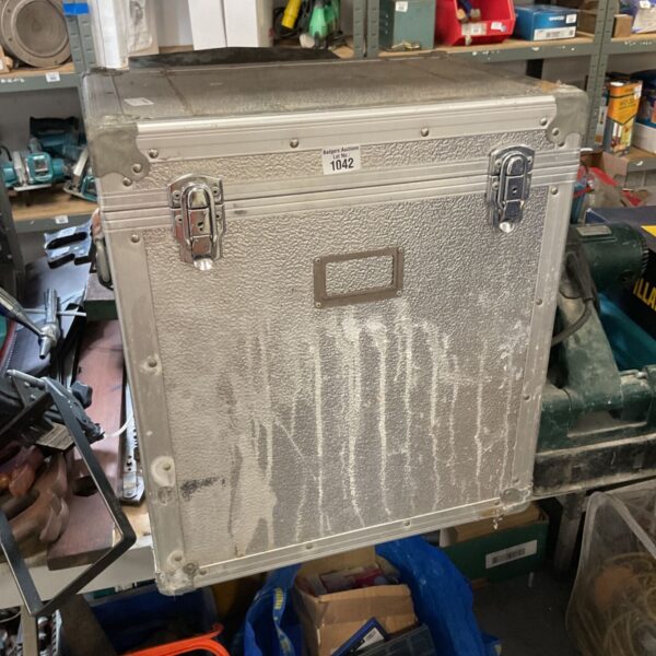 Silver aluminium flight case with a locking clasp and handle.
