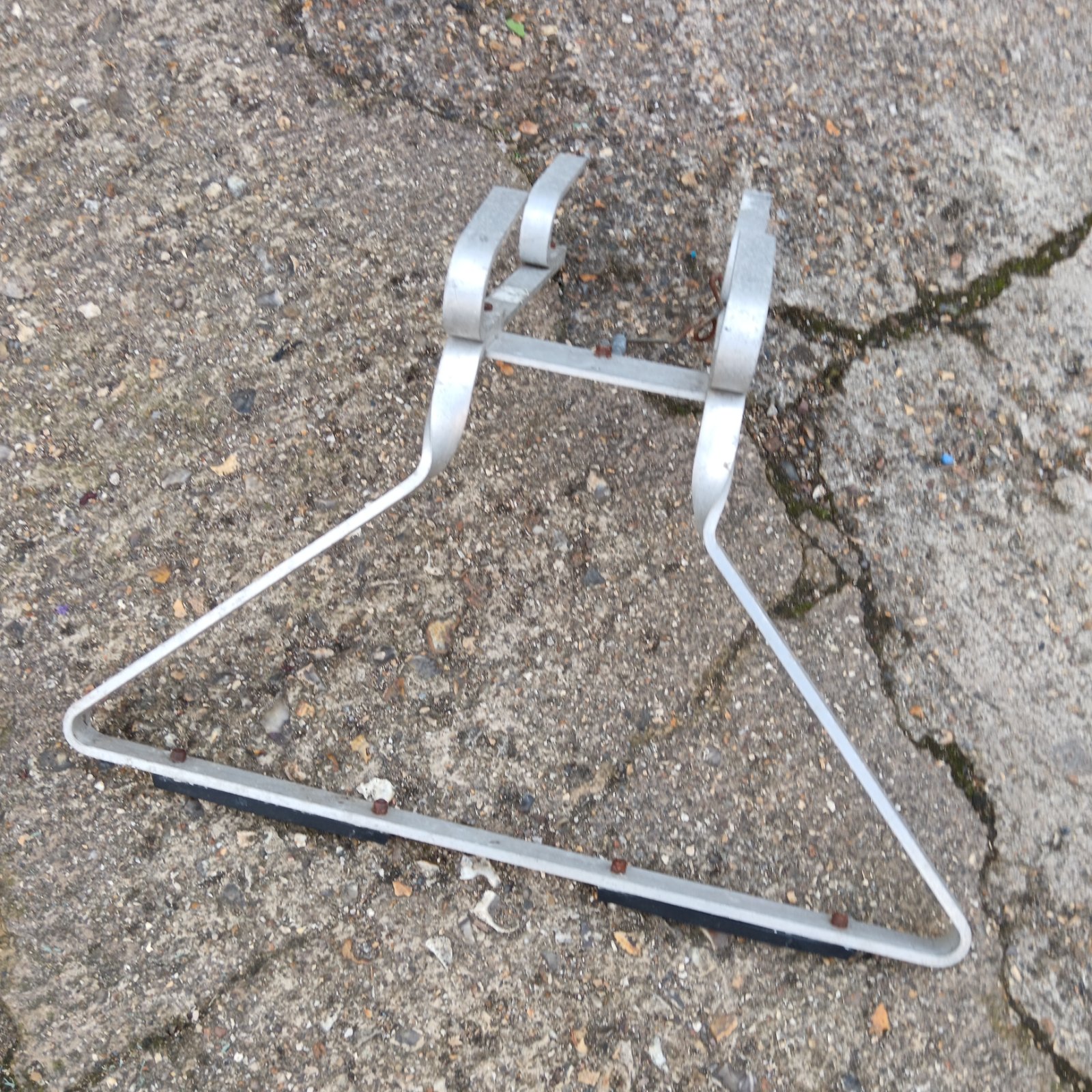 Vintage aluminium ladder stay for folding ladder stability.