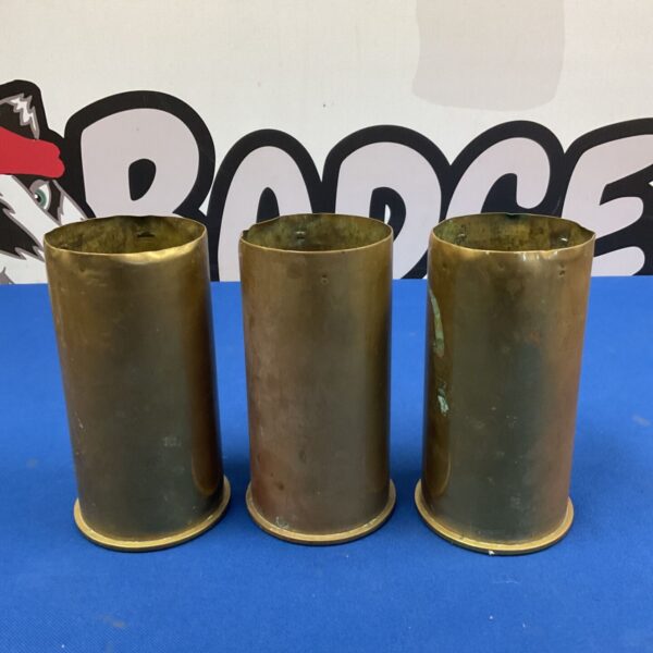 Group of three antique brass cannon shells, vintage military collectables.