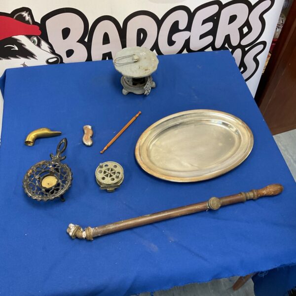 Antique brass garden sprayer with other vintage items.