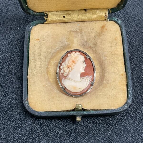 Antique cameo brooch in original leather box, detailed silver setting.