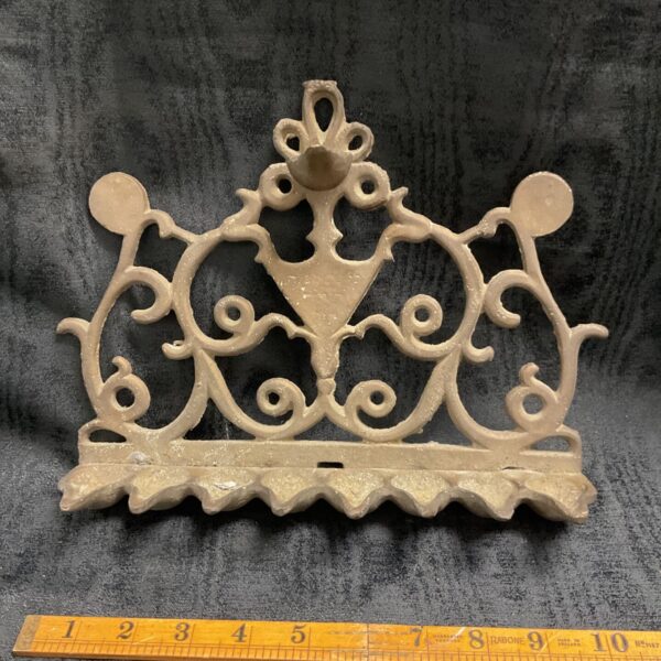 Antique cast iron ornate wall bracket with scrolled openwork and scalloped base