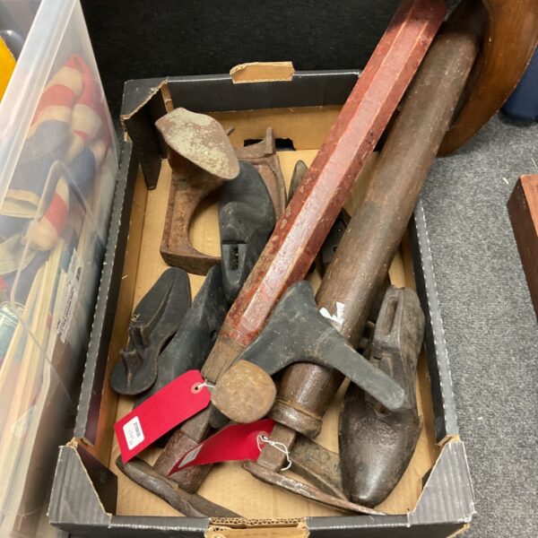 Antique cobblers shoe lasts collection, vintage shoemaking tools.