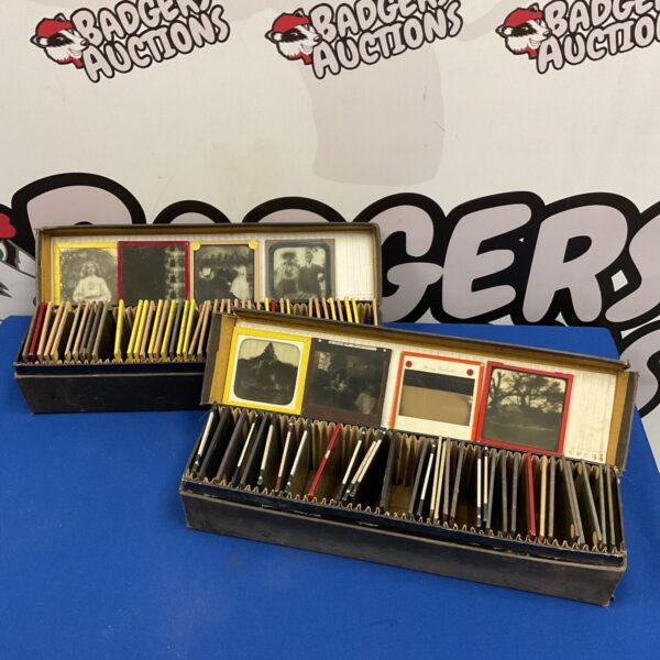Two boxes of antique glass magic lantern slides with portrait and landscape images