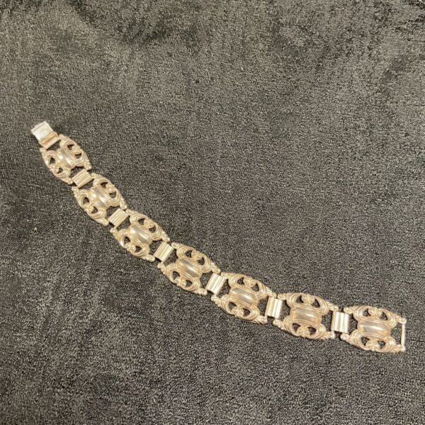 Antique Indian silver bracelet with decorative links.