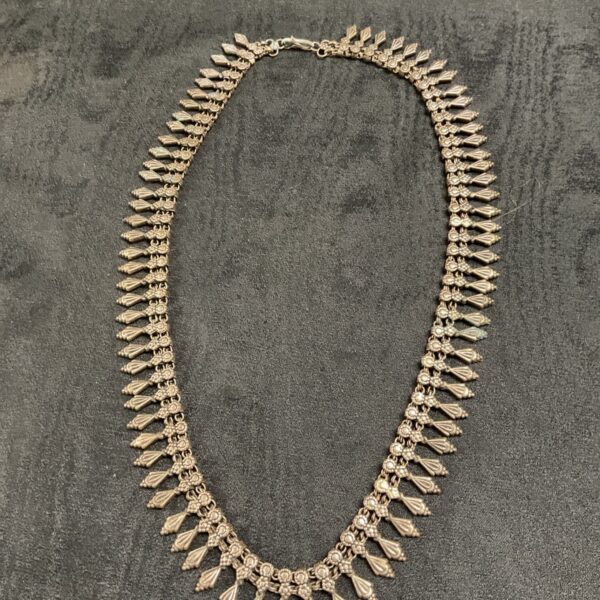 Antique Indian silver necklace with delicate fringe detail.