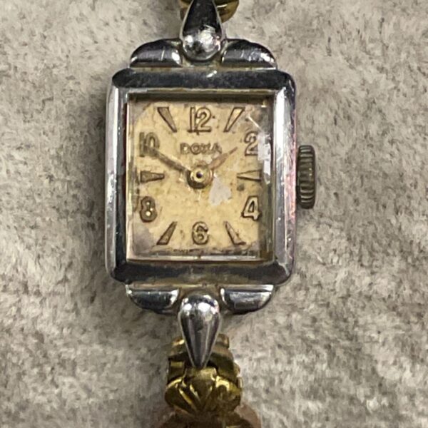 Antique ladies wristwatch with Art Deco details and gold band.