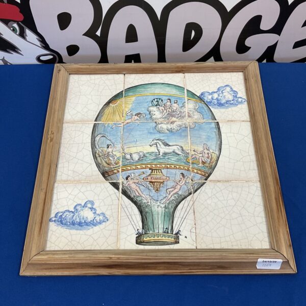 Antique ceramic tiles depicting the historic Le Fesselle hot air balloon.