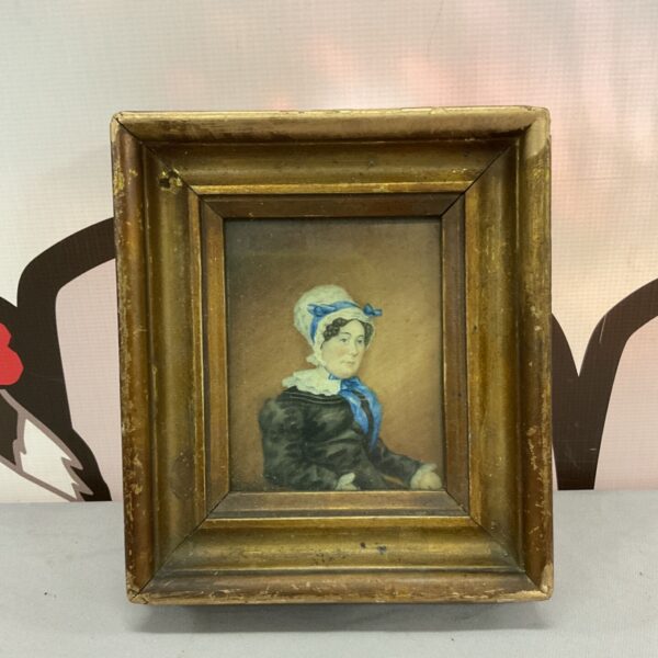 Antique miniature portrait of a lady in Victorian dress.