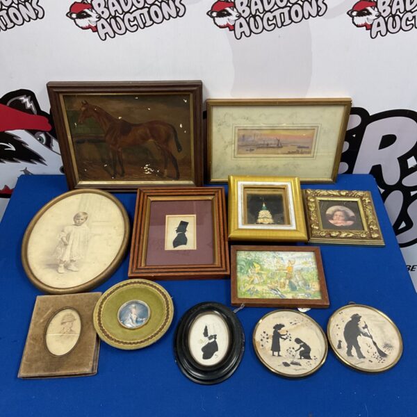 Antique miniature portrait collection with silhouettes and framed paintings.
