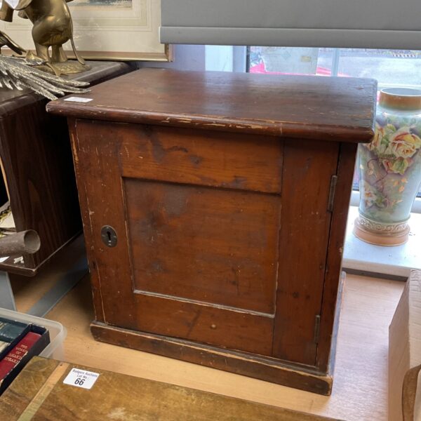 Antique oak medicine cabinet with panelled door and keyhole escutcheon