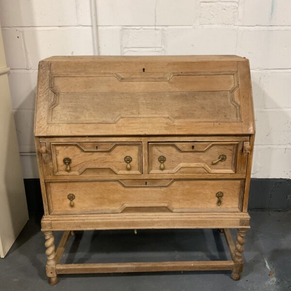 Antique oak writing bureau with barley twist legs and brass drawer pulls
