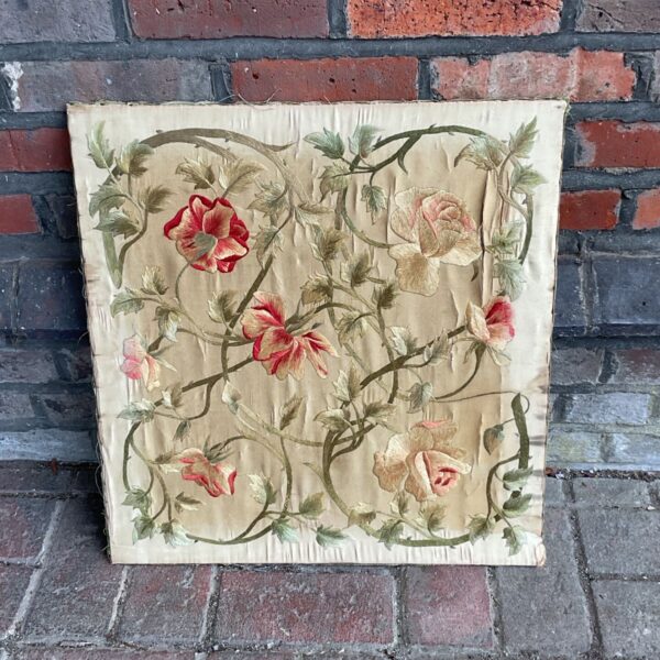 Antique 19th century silk floral panel with detailed embroidery.