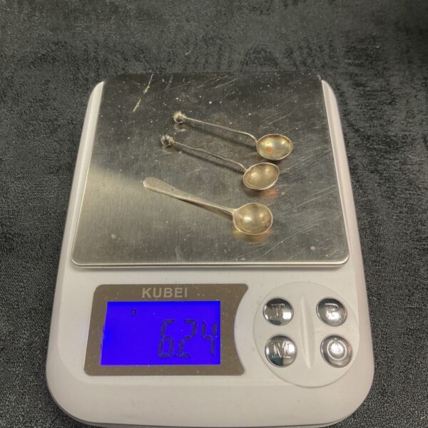 Three antique silver mustard pot spoons with ball-ended handles and oval bowls