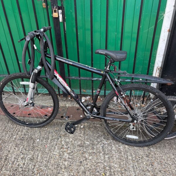Black Apollo XC26 mountain bike with front suspension.