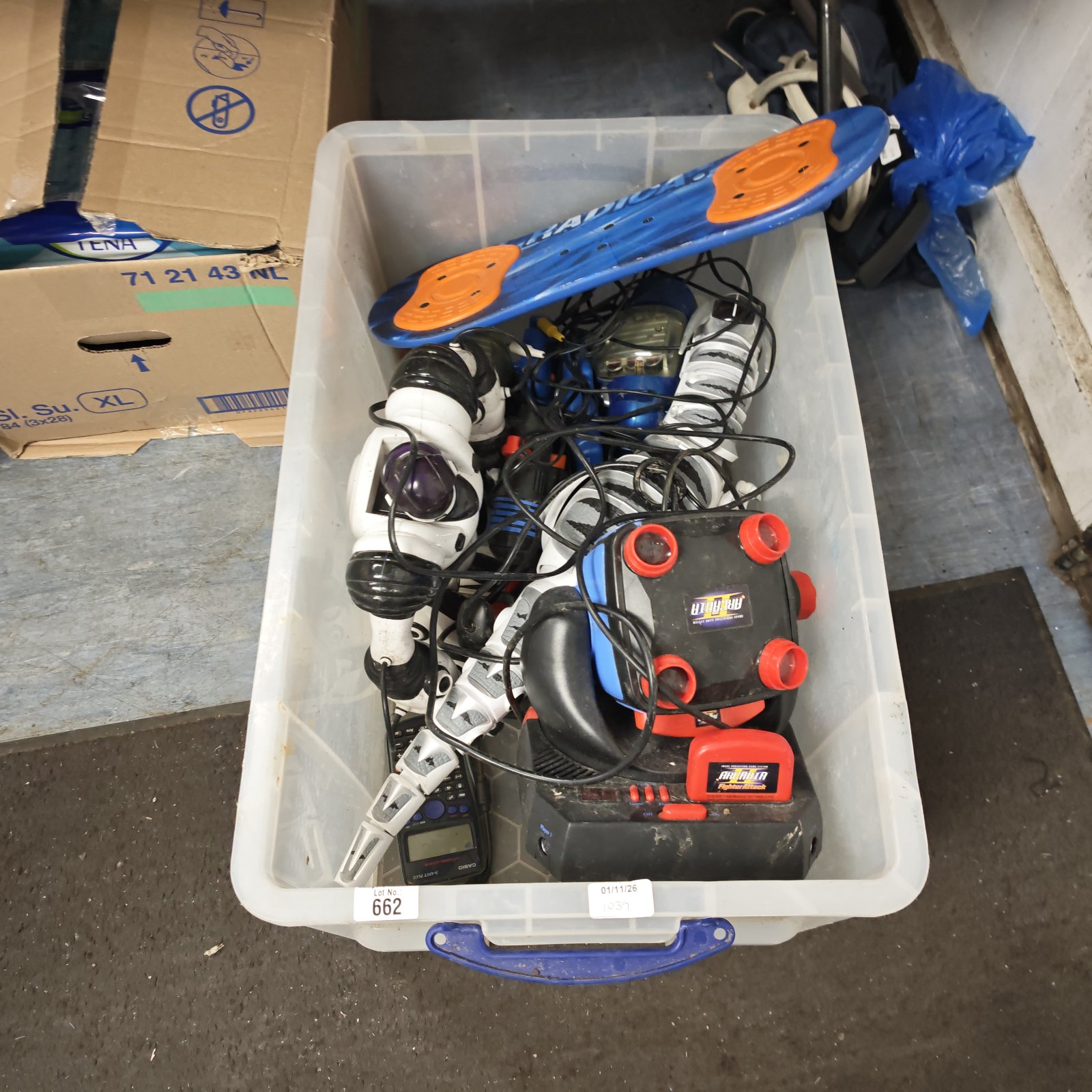 Clear storage box of mixed electrical toys including Arcadia Fighter Attack II