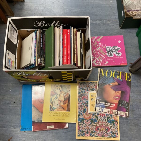 Collection of art books including Taschen publications for art enthusiasts.