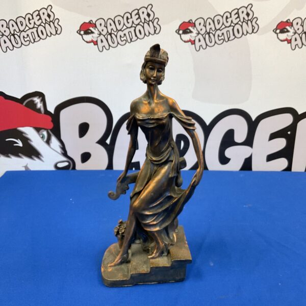 Art Deco lady sculpture in bronze resin, descending a staircase.